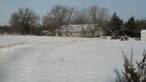 Looking north toward the house.  Tilly and the Jeep are on the right.   Note the broken tree to the left of the house. This was before the trees were trimmed up and the brush cut. December 2012